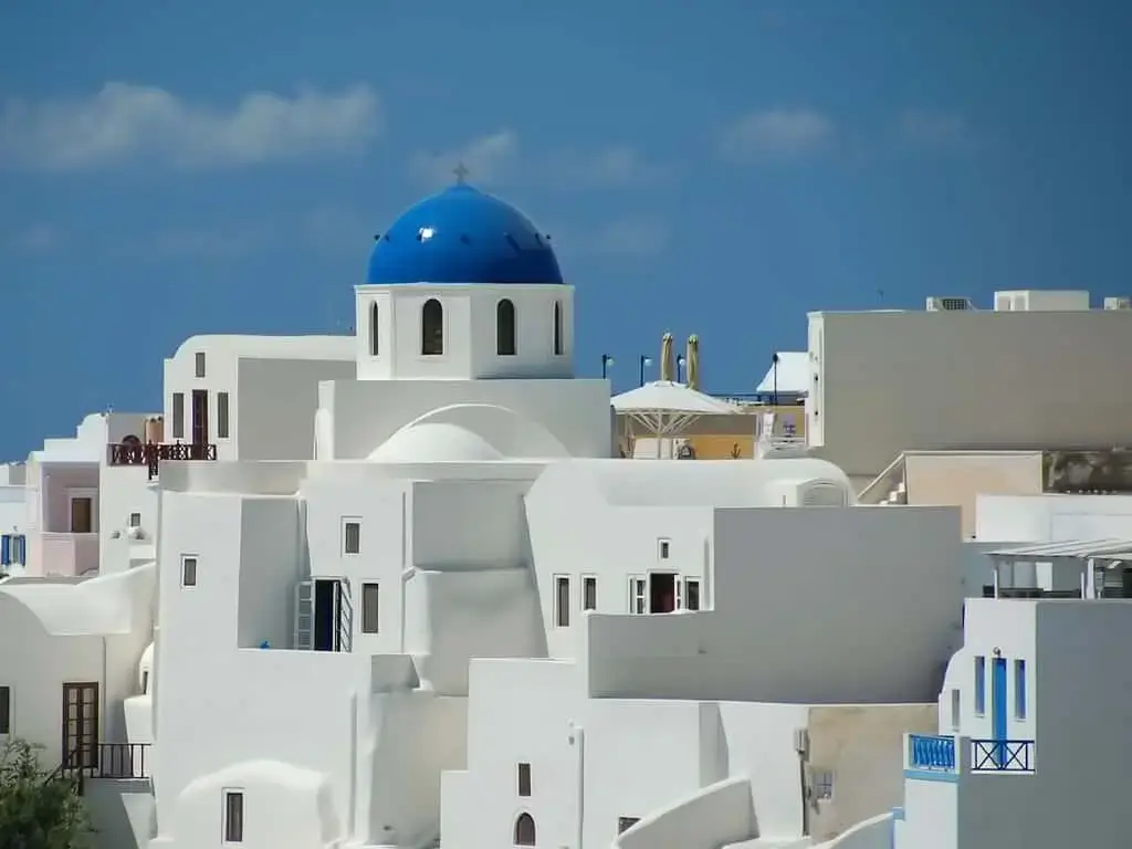 Iconic view of Santorini, Greece with its white buildings and blue domes.