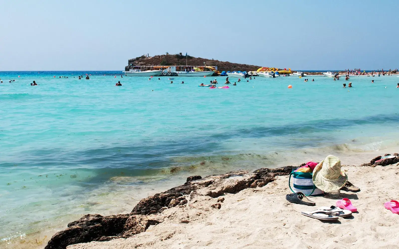 Sunbathers on a beautiful Mediterranean beach.
